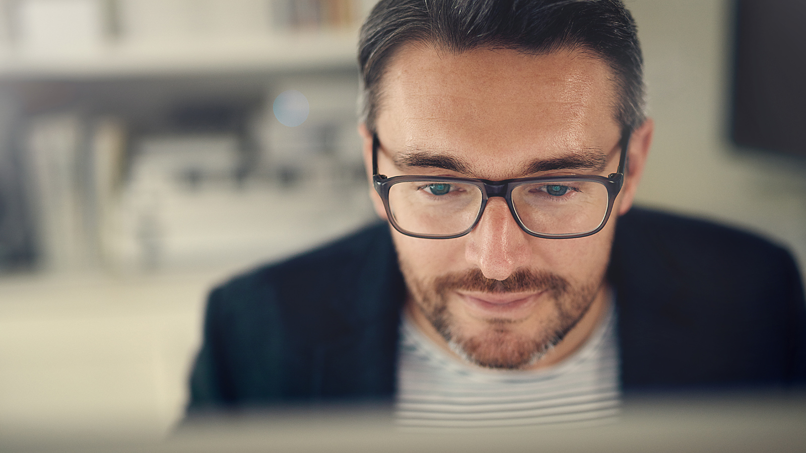null Man looking intently at portfolio