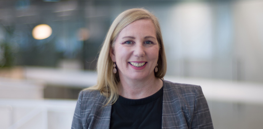 null Head shot of Sue Wallace, Head of the Office of the Superannuation Trustee, smiling at the camera.